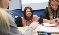 A Marketing professor engaging with her students