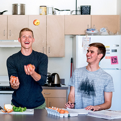 students cooking in dorm kitchen