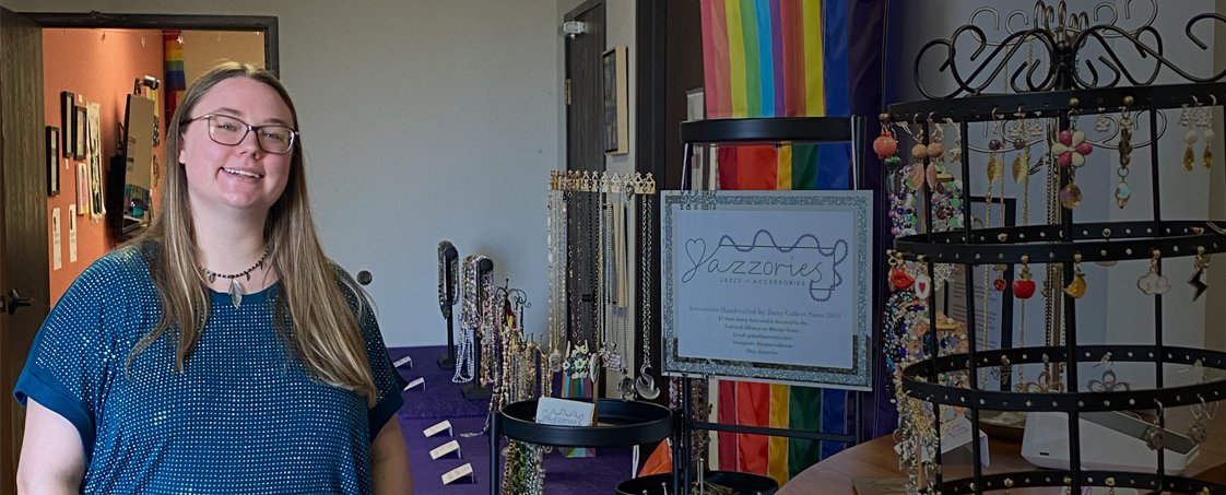 Jazzy Colbert in front of a display for her jewelry business